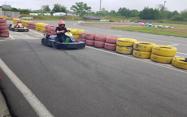 Man go-karting on a motor racing track
