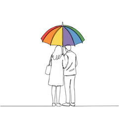 Couple standing together under a colorful rainbow umbrella  