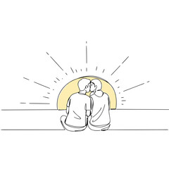 Couple kissing while sitting together at sunrise with warm light  