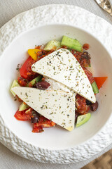 Portion of greek salad with fresh vegetables