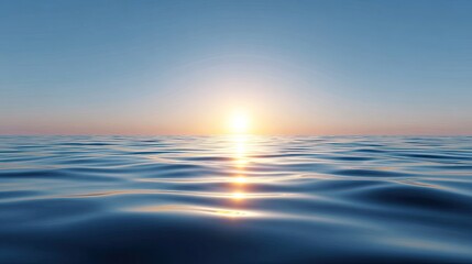 Fototapeta premium Serene Sunrise Over Calm Ocean Waves with Clear Blue Sky Above the Horizon