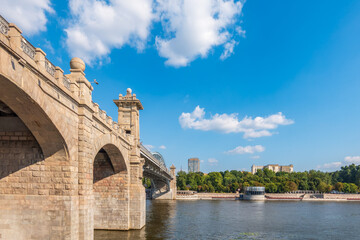 View of the Moscow river embankment, Pushkinsky bridge and cruise ships at sunset.