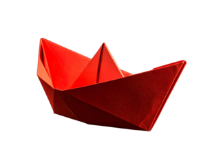 Red origami paper boat on a black background 