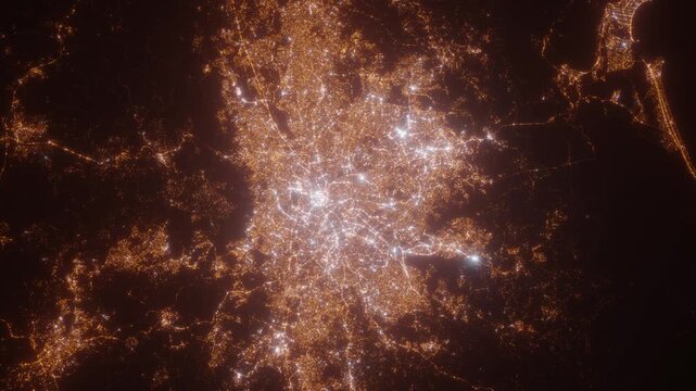 Sao Paulo (Brazil) aerial view at night. Top view on modern city with street lights. Camera is zooming out, rotating clockwise. Vertical video. The north is on the left side