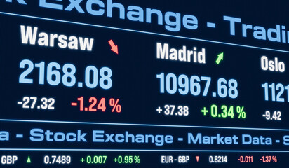 Obraz premium Madrid stock index moving up and Warsaw index moving down. Stock exchange, trading board, market data, business, investment, currency information.