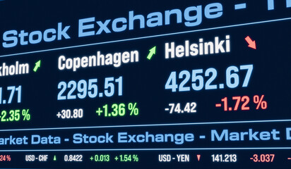 Fototapeta premium Copenhagen stock index moving up and Helsinki index moving down. Stock exchange, trading board, market data, business, investment, currency information.
