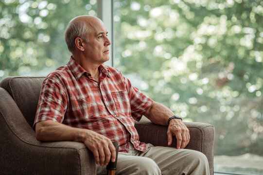 portrait of a senior woman sitting on a bench