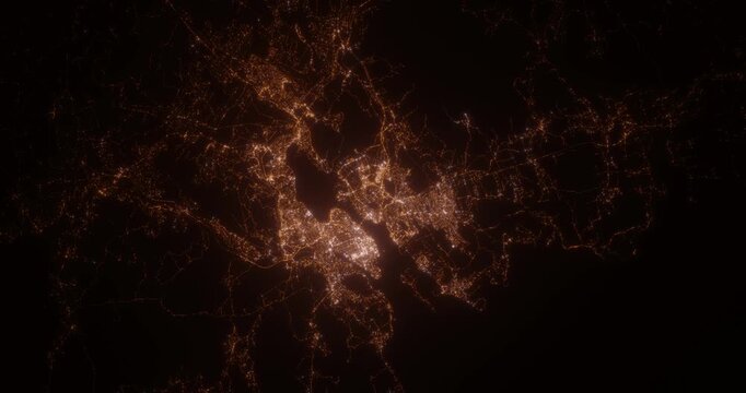 Halifax (Canada) aerial view at night. Top view on modern city with street lights. Camera is flying above the city, moving backward