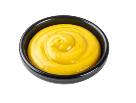 Yellow mustard swirl in black ceramic bowl on transparent background