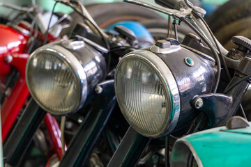 Obraz premium vintage motorcycle headlights with chrome housings and classic retro design.