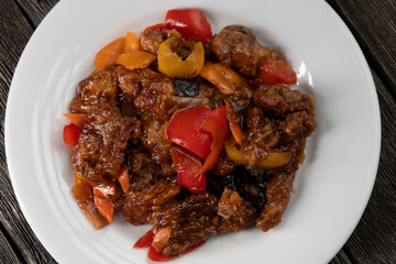 Stir Fried Eel with Vegetables on wooden background. Chinese food. Asian cuisine