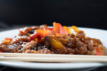 Stir Fried Eel with Vegetables on wooden background. Chinese food. Asian cuisine