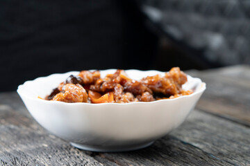 Stir Fried Eel with Vegetables on wooden background. Chinese food. Asian cuisine