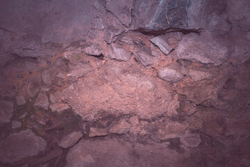 Unusual stone masonry with rocks of different sizes. Natural textured background