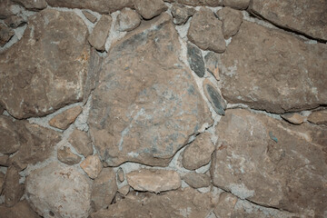 Unusual stone masonry with rocks of different sizes. Natural textured background