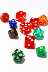 Assortment of vibrant dice of various shapes on a pristine white surface, ready for play.