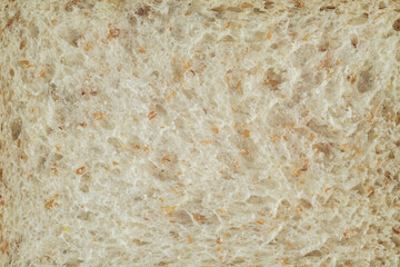 close up shot of a surface texture of sliced whole wheat sandwich bread for food background wallpaper