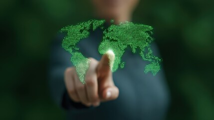 Sustainable energy solutions concept, A hand points at a digital world map, symbolizing global connectivity and technological interaction.