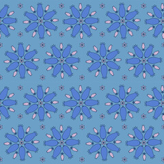 Funny blue flowers with different buds on a seamless blue background
