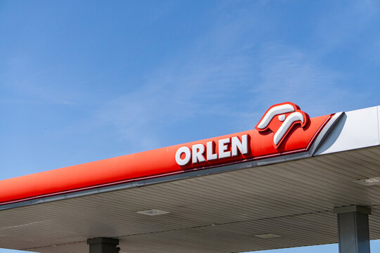 ORLEN gas station canopy and logo against blue sky