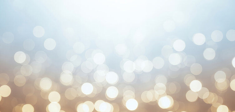 Abstract background with bokeh lights in blue, white, and gold tones, delivering a classy and festive feel great for elegant product presentations, celebration themes, or premium digital content.