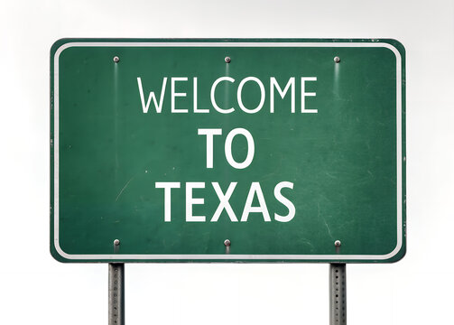Welcome to Texas: A green road sign, bearing the words Welcome to Texas stands boldly, with the warm sun casting a radiant glow over its surface.