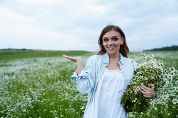 Young woman in white dress holding daisies in field,embracing natures calm through flower therapy,therapy that heals through scent, therapy for body and mind.Great for wellness, spa, mindfulness ads.