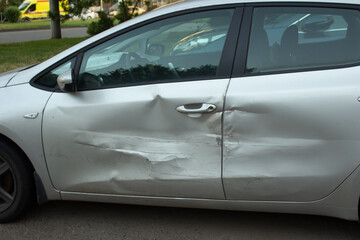 dent on the car, broken car