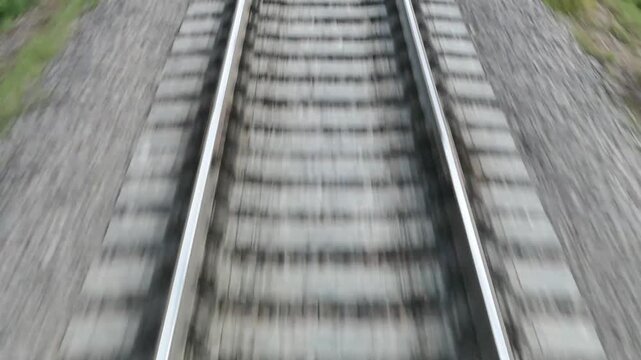 Fleeing away the ties and rails. The view from the back window of the train car.