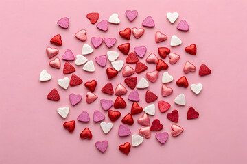 pink heart confetti on solid background