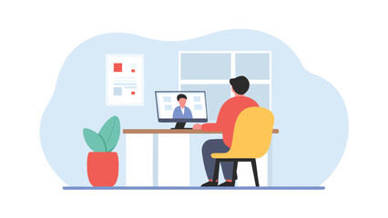 Person at desk on video call with another person displayed on computer screen in office setting view from back