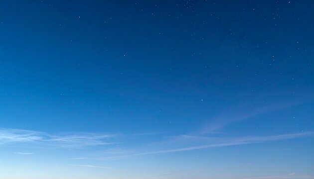 Gradient blue sky at twilight with wispy clouds, blending into a starry night, crystal-clear