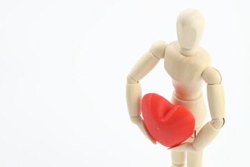 心を込めて愛を抱くデッサン人形