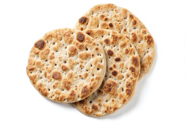 Matzah Shmurah, traditional Jewish unleavened bread for Passover. Three round, textured, baked flatbreads isolated on white background. Symbol of Pesach celebration, cultural food, religious