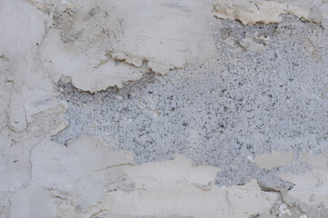 Texture of old rustic wall covered with gray stucco plaster