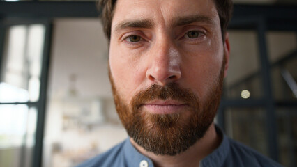 Obraz premium Confident Caucasian adult man face close up parent portrait looking at camera alone at home apartment serious middle-aged male father feeling sad pensive tenant bearded dad guy ponder contemplating