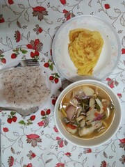 Thai Homemade Meal with Omelette, Tom Yum Soup, and Rice