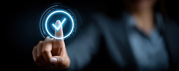 A hand is pressing a glowing digital checkmark button on a transparent interface, symbolizing approval or completion in a futuristic, high-tech environment.