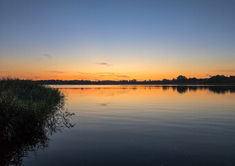 sunset over the river warnow near rostock