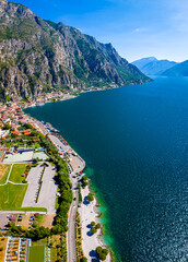 Aerial view of Limone sul Garda, a colorful lakeside town in Italy nestled between Lake Garda and...