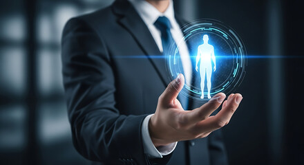 Businessman holding a glowing digital human silhouette representing future health and science.
