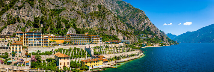 Aerial view of Limone sul Garda, a colorful lakeside town in Italy nestled between Lake Garda and...