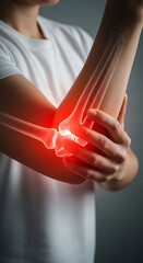 Human elbow joint with a highlighted inflammation depicting joint pain and medical issues.