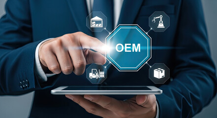 OEM Concept: Businessman Touching Original Equipment Manufacturer Icon on Tablet for Production, Manufacturing, and Supply Chain Management Solutions