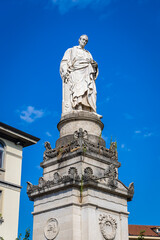 Obraz premium Neoclassical Volta Temple monument in Como, Italy, with columns, domed roof, and lakeside park setting under clear summer skies.