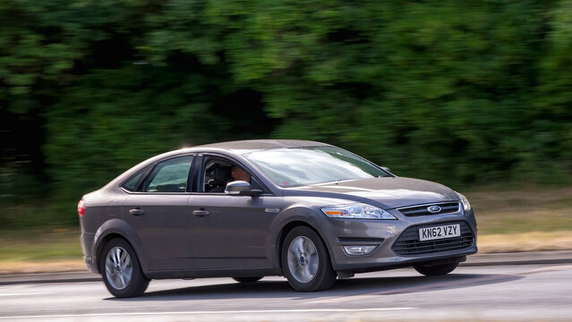 Milton Keynes,Bucks,UK - July 17th 2025:  2012 Ford Mondeo car driving on a British road