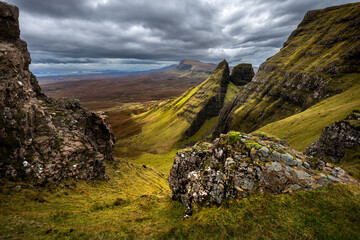Spectacular landscape of Dun Dubh on The Trotternish Ridge with dramatic storm clouds in the sky. Isle of Skye, Scotland, UK.