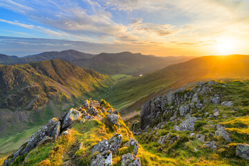 Beautiful Lake District sunset in the mountains on a summer evening looking down into Buttermere Valley, seen from Dale Head.
