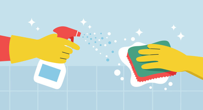 Yellow-gloved hands spraying cleaner and scrubbing with a sponge on a tiled surface, illustrating cleanliness.