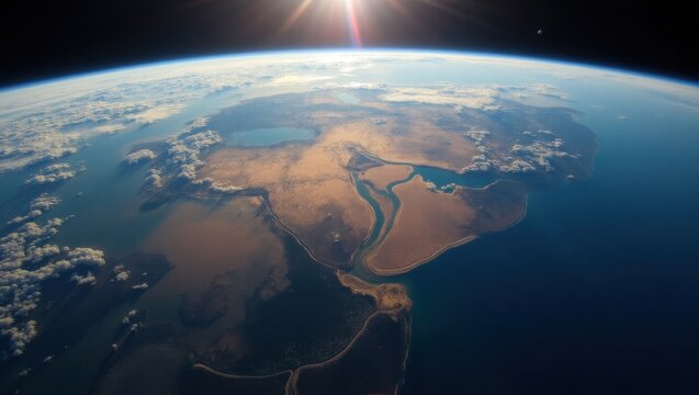 Perspectiva de Oriente Medio desde una estaci&oacute;n espacial, con desiertos, ciudades y r&iacute;os visibles bajo capas de nubes dispersas